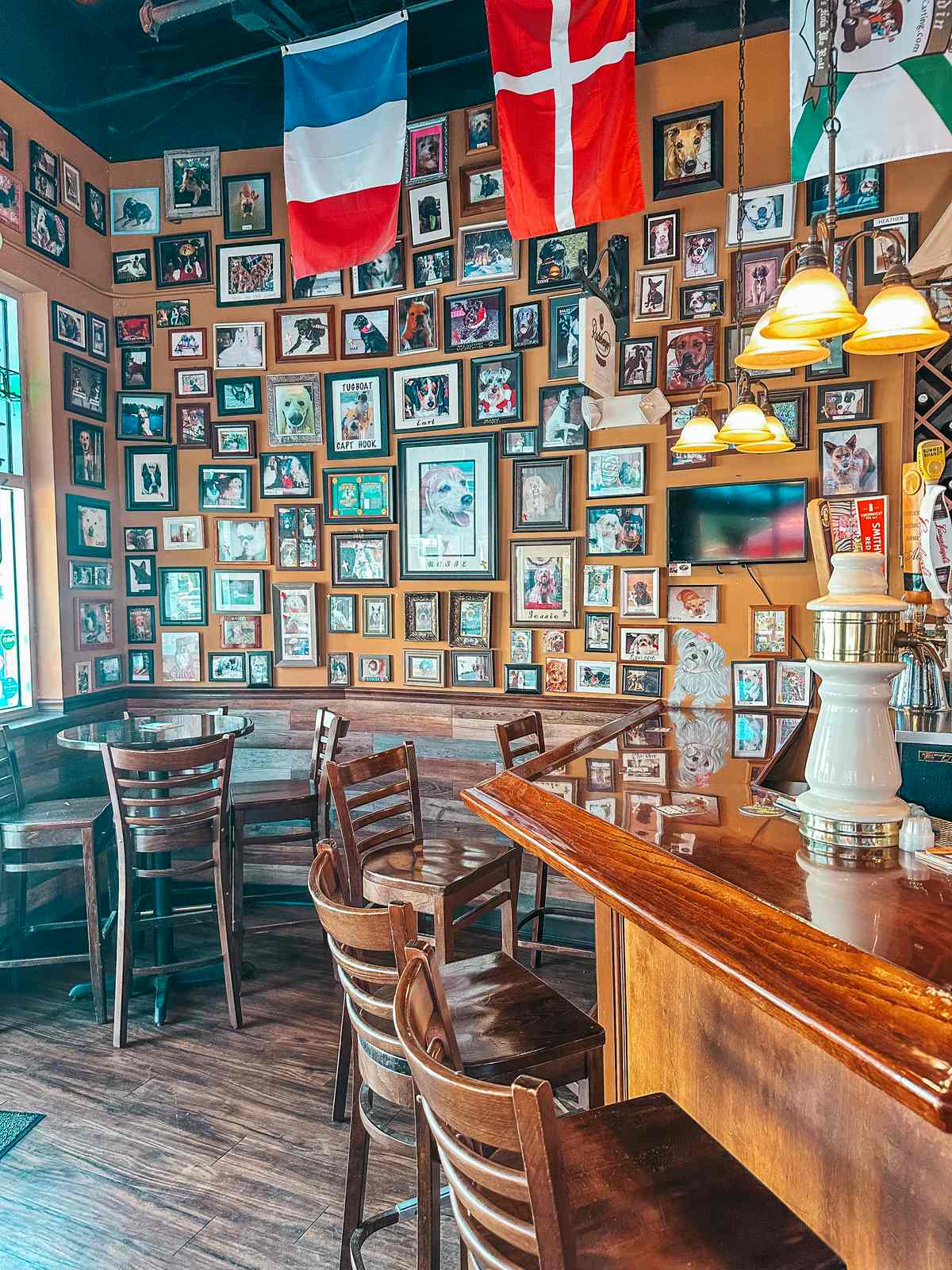 Inside Rosie's Tavern of Dunedin — the dog photo wall and bar corner