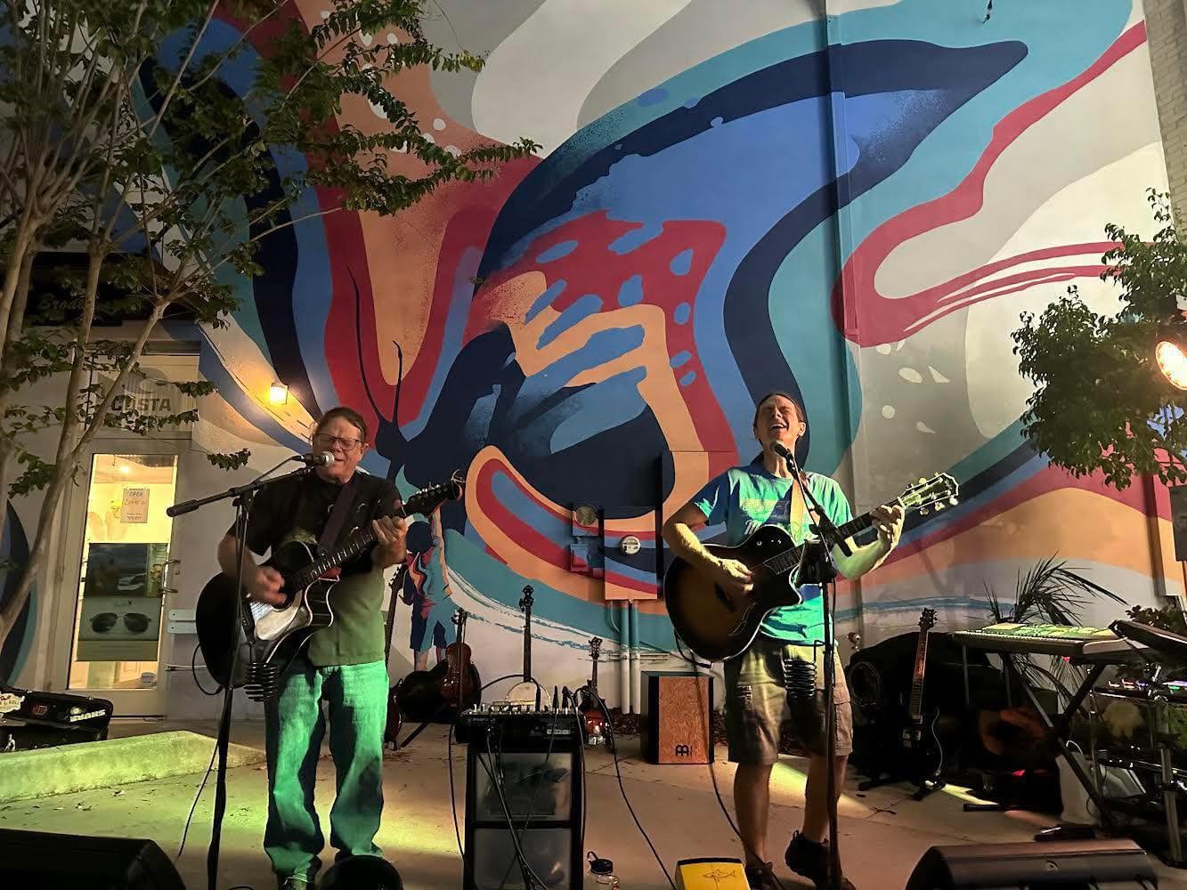 Musicians playing at open mic night on the patio at Rosie's Tavern of Dunedin